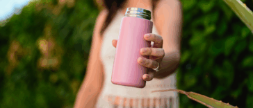 A woman holding a metal