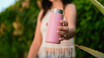 A woman holding a metal
