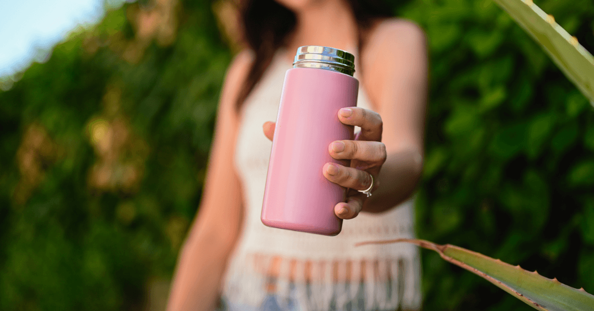 A woman holding a metal