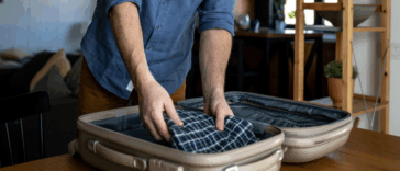 Man packing suitcase