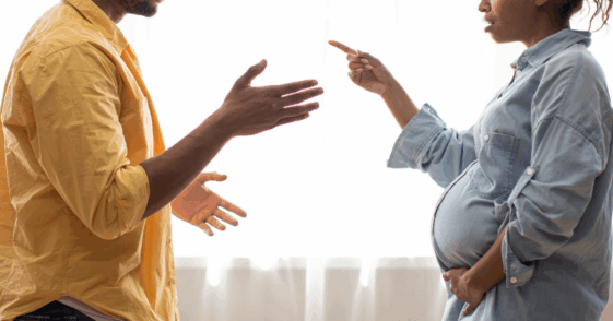 Man and pregnant woman arguing