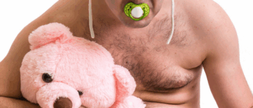 Guy dressed as a baby