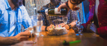 people celebrating birthday in restaurant