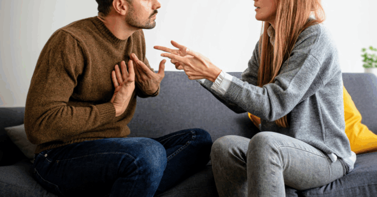couple argue on couch