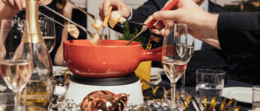 people eating fondue during the holidays