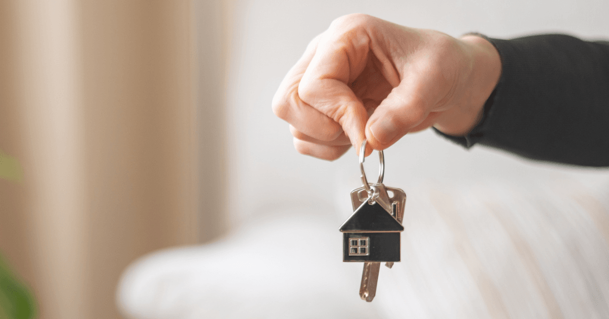 person holding house key