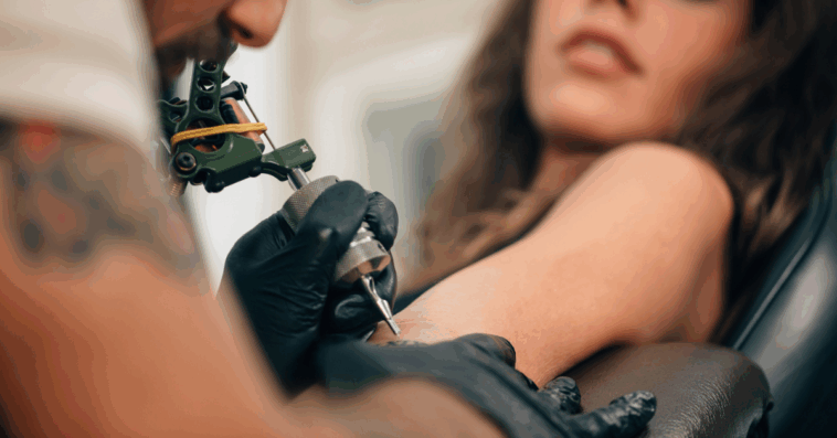 woman getting tattooed