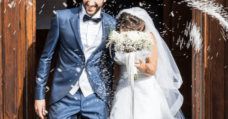 newly married couple leaving church