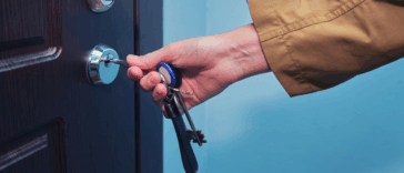 Woman unlocking an apartment door