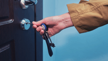 Woman unlocking an apartment door