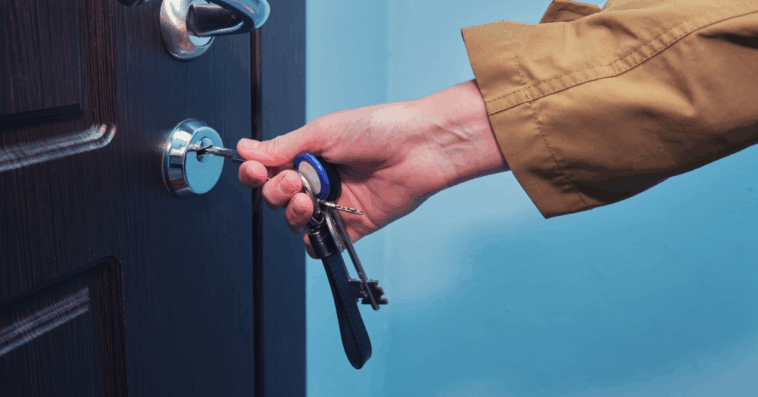 Woman unlocking an apartment door