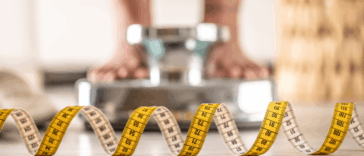 Woman standing on a scale