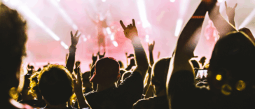 People dancing at a concert.