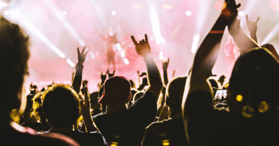 People dancing at a concert.