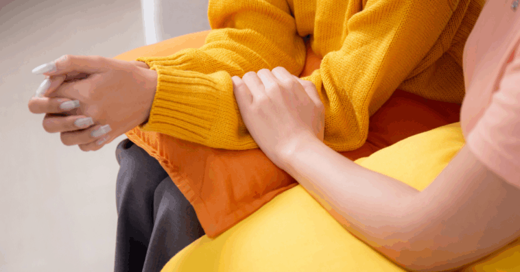 Woman comforting a friend