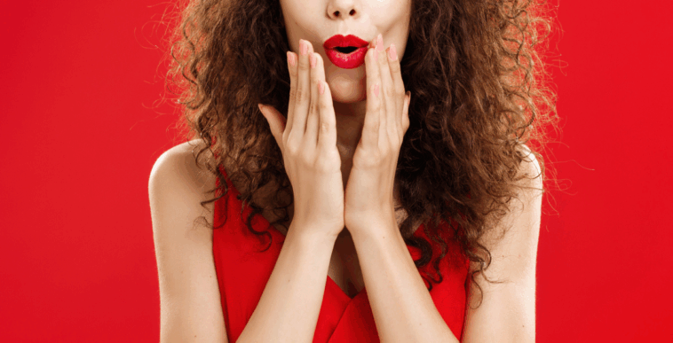 Shocked woman wearing red lipstick