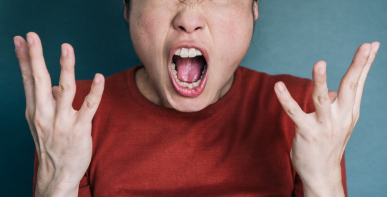 Furious woman screaming