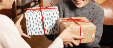 Two women exchanging presents.