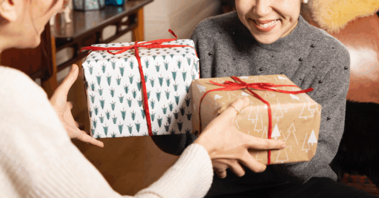 Two women exchanging presents.