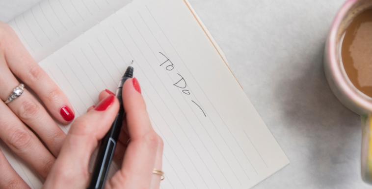 woman writing to do list