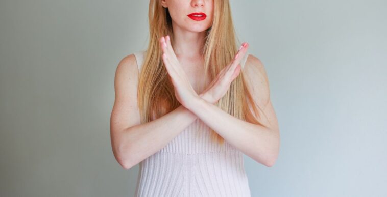 Photo of mature pretty woman crossed hands show no stop forbidden symbol isolated background.