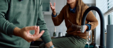 A couple having an argument in the kitchen