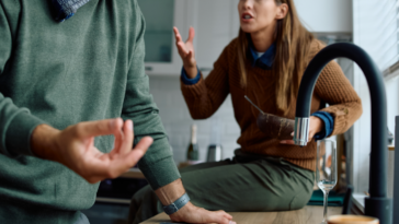 A couple having an argument in the kitchen