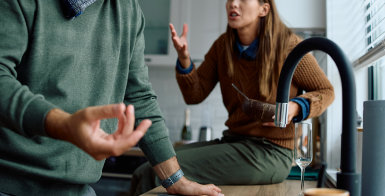 A couple having an argument in the kitchen