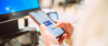 A person with a digital gift card on their phone.