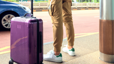 Guy traveling with suitcase