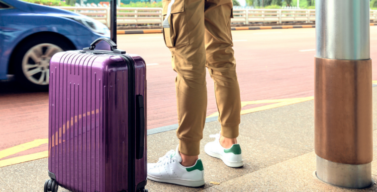 Guy traveling with suitcase