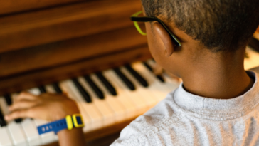 A boy playing the piano.