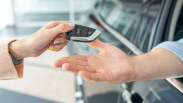 Man receiving new car keys