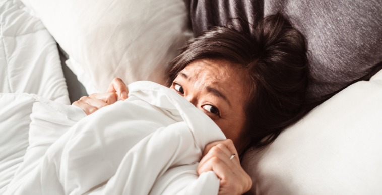 Woman tucked into bed