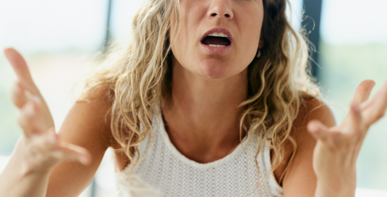 upset woman pleading with unseen person