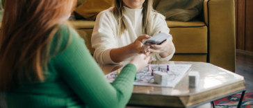 two women playing a board game