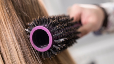 Person brushing their long hair