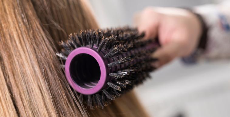 Person brushing their long hair
