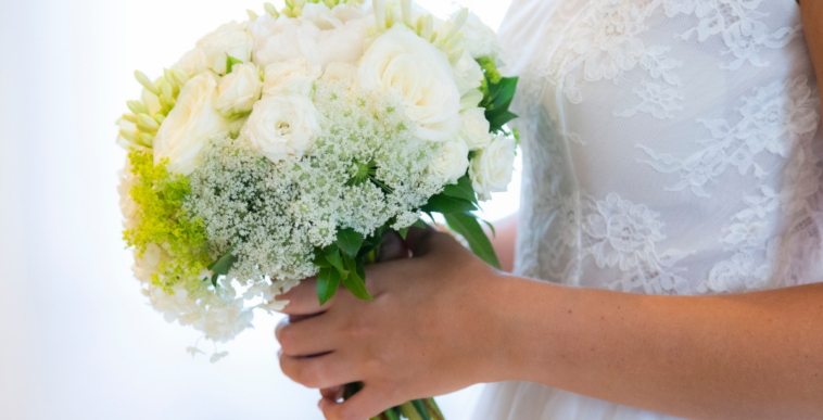 A bride holding a bouquet.