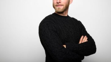 Portrait of a Young Man looking away against White Background.