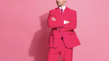 A man in a pink suit.