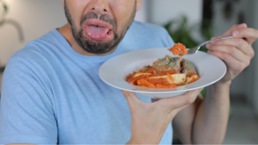 Man disgusted by plate of food
