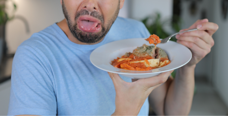 Man disgusted by plate of food
