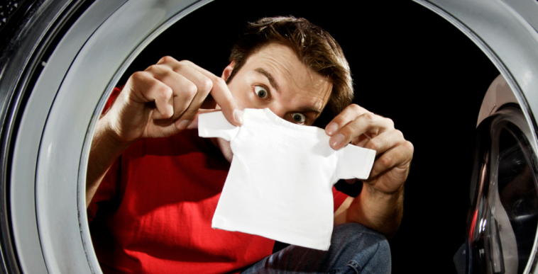 Man looking at shrinking clothes
