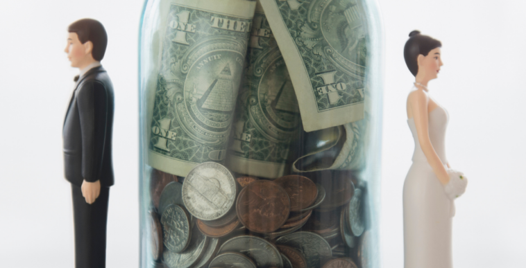bride and groom figurines with jar of money