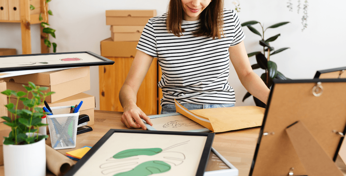 woman framing artwork