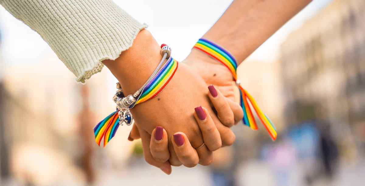 two women holding hands