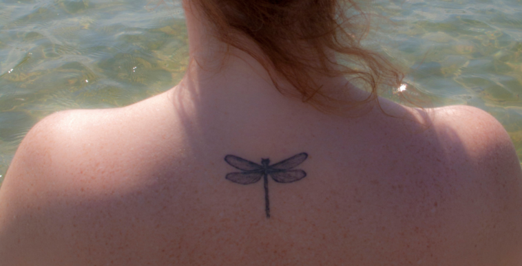 woman with dragonfly tattoo