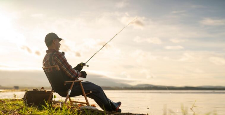 Man on a fishing trip by the lake.