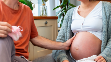 Couple discussing pregnancy